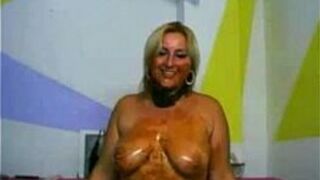 Kinky blonde MILF playing with chocolate - porn video
